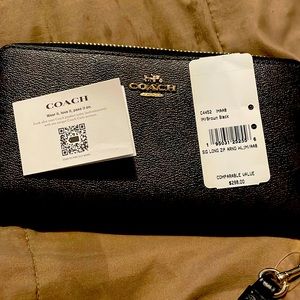 Coach clutch brand new with tags and barcodes